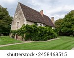 Old Traditional French House covered with common ivy (Hedera Helix), Chancellery from the Diane De Poitiers Garden of Chateau de  Chenonceau Castle