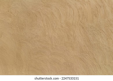 Old traditional house wall texture in Shindaga, Dubai. Brown beige sandy color rough plaster background. - Shutterstock ID 2247533151