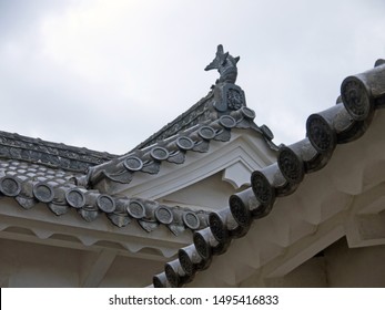 Old Traditional Japanese House Pagoda Roof With Black Clay Roof Tile Decorated With Koi Carp Fish Sculpture On Roof Ridge