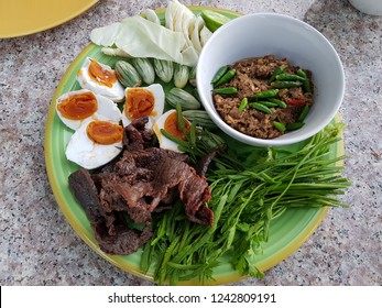 Old Traditional Local Thai Food Of Fermented Shrimp Paste Sauce With Sweet Pork Condiment And Crispy Deep-fried Fluffy Fish Served With Salted Duck Egg Yolk Balls, Fried Pork And Fresh Vegetable.