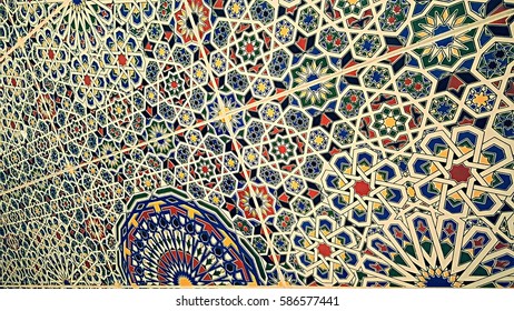 old traditional Moroccan zellije tiles, Ceramic Zellije tile-mosaic wall, colorful Islamic geometric pattern, Arabe Arabic texture background. - Shutterstock ID 586577441