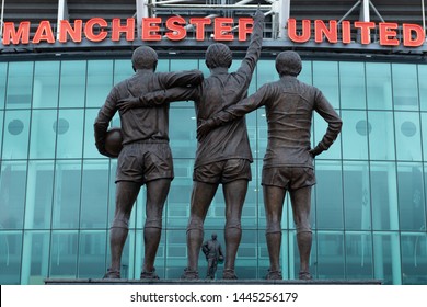 Old Trafford, Manchester/UK - July 6 2019: Shots of Old Trafford football ground home to Manchester United football club. MUFC. Shots show the red lettering of the club, some with statues in front. 