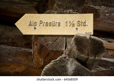 Old Trail Sign On A Wooden Hut