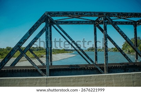 Old train bridge over a river in Montana.