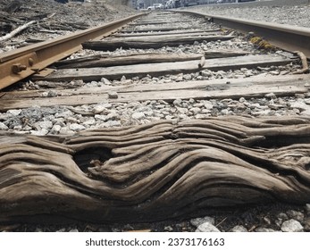Old train tracks with textured wood