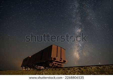 old train wagon and the milky way in the background 