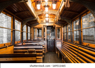 an old tram interior, wooden seats in the garage