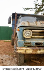 Old Truck Detail In Rural Area. Highlighted Front And Headlight