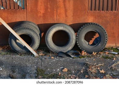 Old Truck Tyres In A Cluttered Backyard Repair Shop