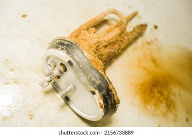 Old Tubular Electric Heater That Has Worked Inside A Household Boiler For Ten Years Without Maintenance And Cleaning. Corrosion, Rust And Mineral Deposits On The Heating Element. Repair Boiler