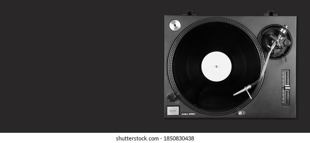 An Old Turntable Player With Lp Vinyl Record On The Desk