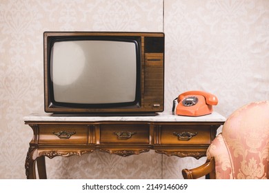 Old tv and telephone in an interior place with decoration in retro style. - Shutterstock ID 2149146069