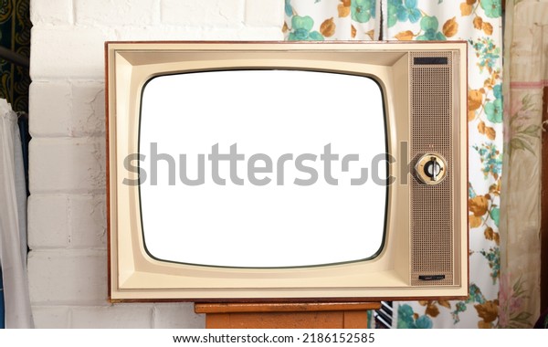Old TV with\
a white screen in a rustic\
interior.
