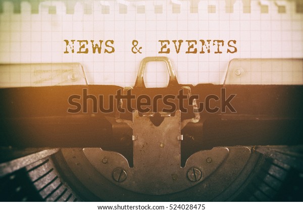Old typewriter with text NEWS & EVENTS.\
Business concept, retro\
filtered.