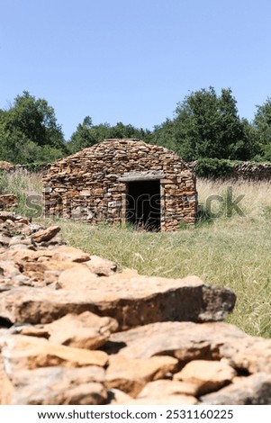 Old and typical stone hut called caborne in French language in Saint Cyr au Mont d'or, France