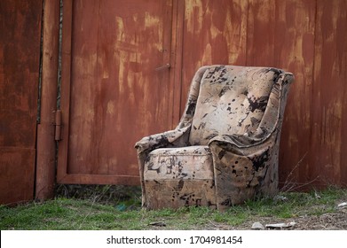 Old Unnecessary Easy Chair Thrown Out Into The Street