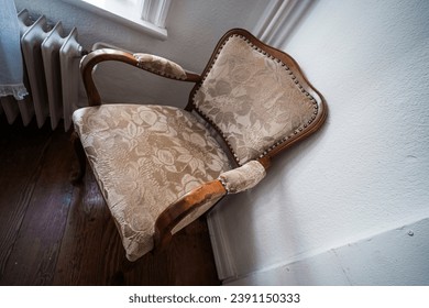 An old upholstered chair from the 19th century.
