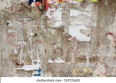 Old Urban Billboard With Torn Peeled Poster Abstract Horizontal Background. Outdoor Bulletin Board Or Plywood Panel With Worn Advertising Message, Notice And Stickers Street Texture. Creative Surface