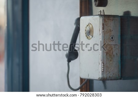 Old urban publick pay telephone booth. Vintage and retro