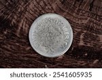 Old USA 1851 year US silver dollar coin on wooden background