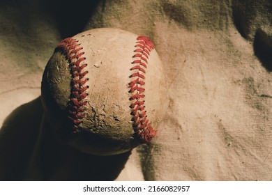 Old Used Baseball Ball Texture Close Up With Copy Space On Vintage Linen Background.