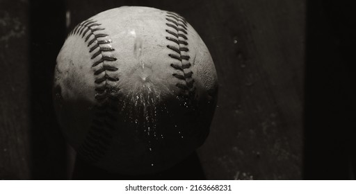 Old Used Baseball Wet From Water Splash For Rain Game Concept.