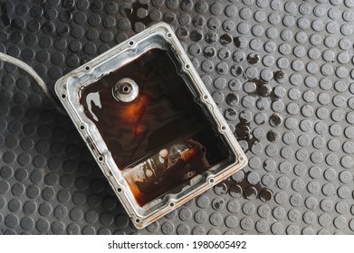 Old used car automatic transmission oil pan. - Shutterstock ID 1980605492