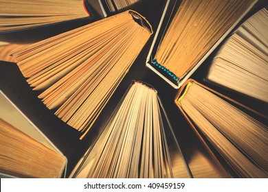 Old and used hardback books or text books seen from above. - Shutterstock ID 409459159