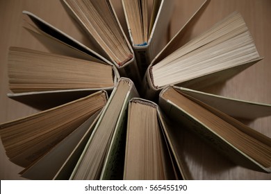 Old And Used Hardback Books Or Text Books Seen From Above.

