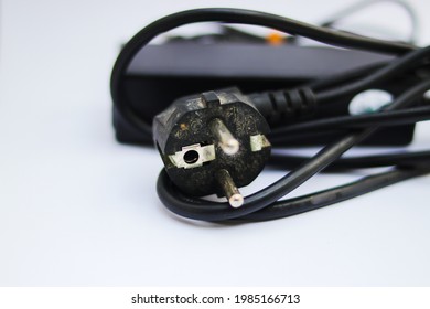 Old Used Laptop Charger Isolated On White Background.