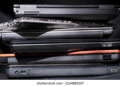 Old used laptop computers for recycling ,Planned obsolescence, e-waste, electronic waste for reuse and recycle concept Stack of old, broken and obsolete laptop computer for repair and recycle - Shutterstock ID 2164883207