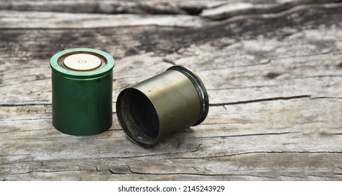 Old And Used M203 Bullet Shells On Wooden Floor, Soft And Selective Focus.