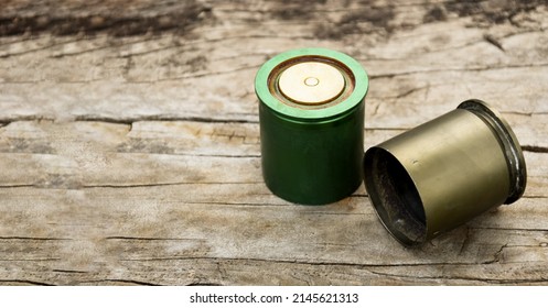 Old And Used M203 Bullet Shells On Wooden Floor, Soft And Selective Focus.