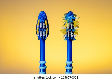 Old Used And New Toothbrush Isolated On A Yellow Background