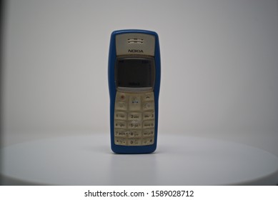 Old Used, Retro Mobile Phone Cellular Nokia 3310, 1100 On A White Background, Italy 2019-12-15