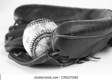 Old Used Vintage Baseball Mitt With Ball In Glove For Player Equipment Close Up.