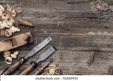 Old used woodworking tools on a vintage workbench: carpentry, craftsmanship and handwork concept