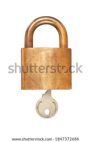 An old USN (United States Navy) brass lock and key isolated on white.