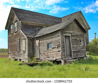 An Old Vacant Wood House With Foundation Issues.