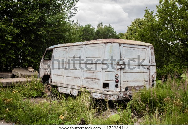The old van thrown in the Urals from the back\
is well preserved