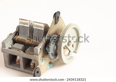 Old variable capacitor with fine tuning mechanism close-up on light background