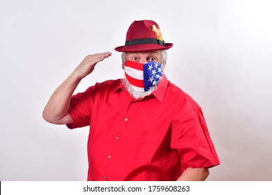 Old Veteran Wearing A Patriotic Mask Giving The Hand Salute.
  Respectful Man Wearing A Patriotic Face Mask Salutes All The Health Care Workers.
  Happy Veterans Day