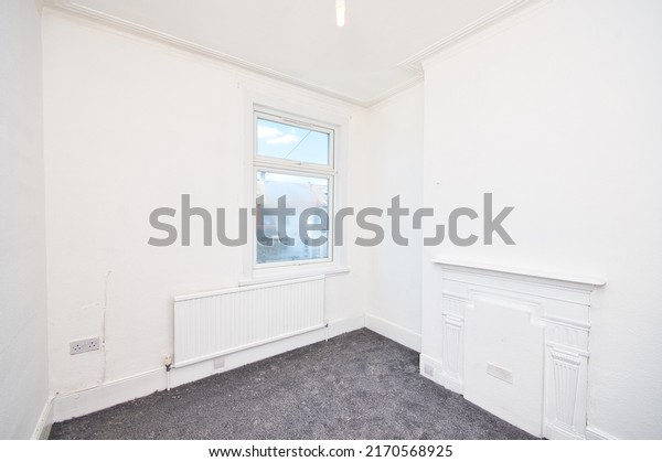 Old Victorian House Bedroom Refurbished with Grey Carpet\
and Flash White Painted Walls - Unfurnished Empty Room in London UK\

