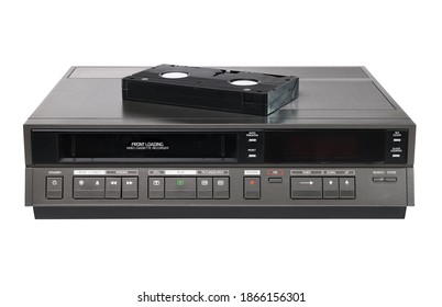Old videocassette recorder 1980s-1990s with videotape isolated on white background. foreground