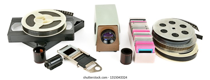 Old Videocassettes And Video Projector With Slides Isolated On White Background. Retro Storage Media. Wide Photo