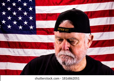 Old Vietnam Vet With Scraggly Beard Looking Down