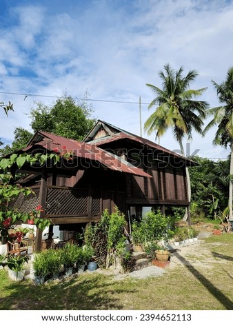 OLD VILLAGE HOUSE. The picture shows the state of old village houses, outside the city and become history and nostalgia for the Malay community in Malaysia.