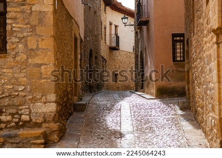 Old village in Spain. Charming old streets. A typical village with beautiful stone houses.