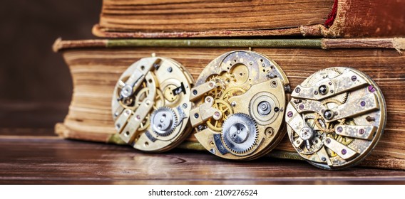 Old vintage antique clockworks and books. Passing time, storytime, watch banner. 