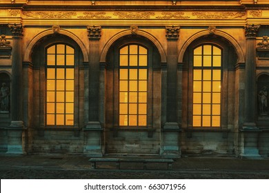 Old vintage arched windows glowing from inside. 